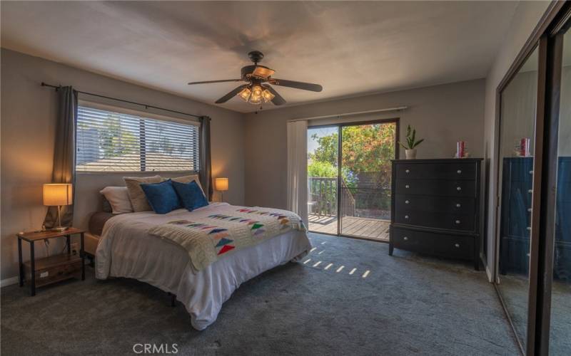 Primary Bedroom with slider to back yard common area