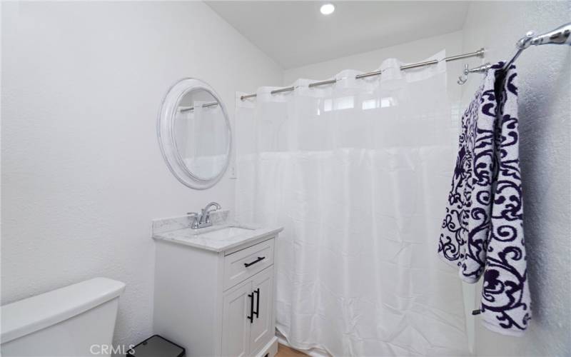 Beautiful bathroom with a re-glazed bathtub and new vanity