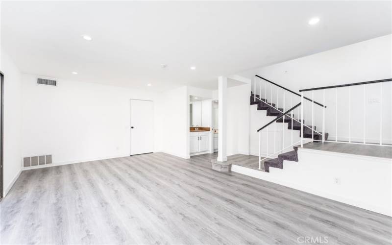 Spacious living area with staircase