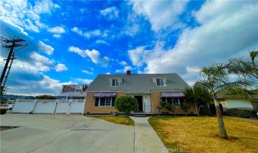 Large front yard with plenty of parking on the driveway and street.