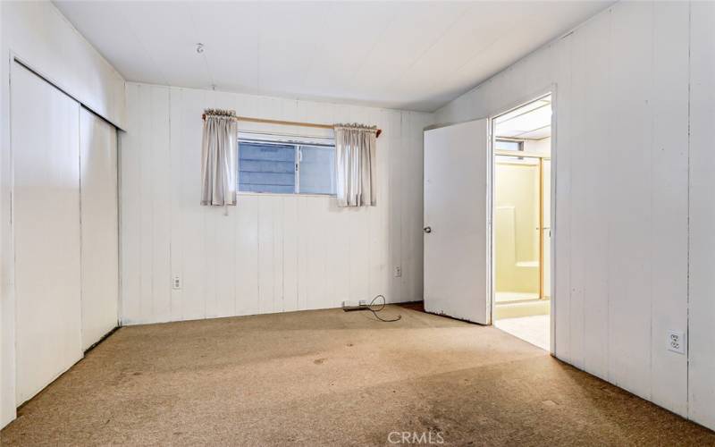 another view of the second bedroom and entry to attached bathroom