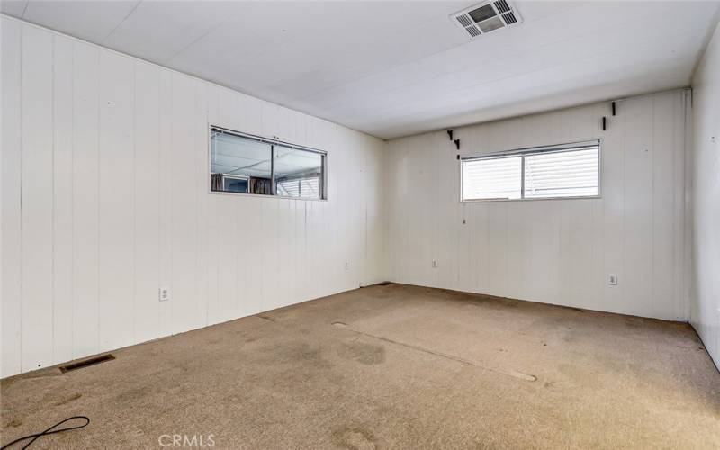 Large primary bedroom at the rear of the home