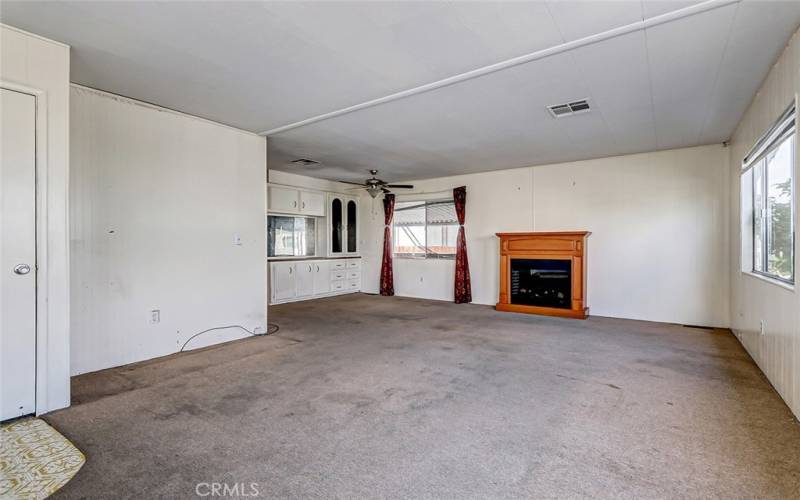 Main door entrance leads into spacious living room, dining room area -nice open concept floor plan.  Coat closet just inside the front door (seen on the left here)