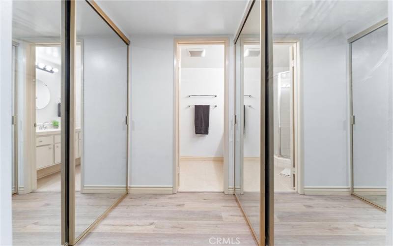 You have two closets on both sides of the hallway the leads to your private bathroom