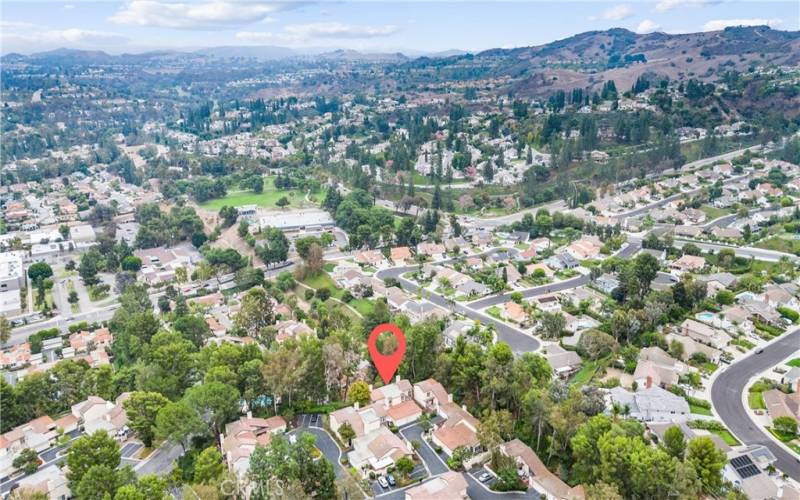 From this aerial view you see the property marked and you can also see a peek a boo view of the community pool.