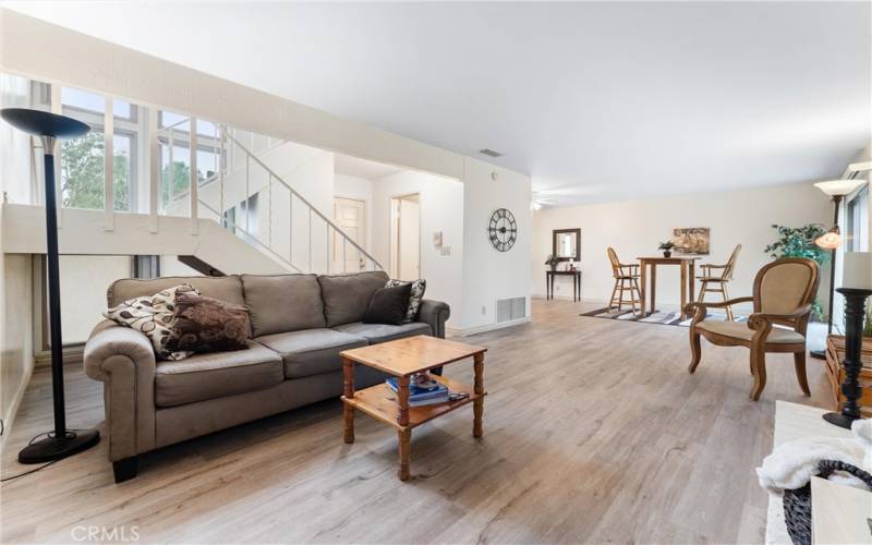 A view of the spacious living room and large dining room.