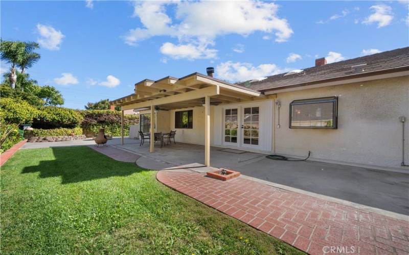 Backyard with covered patio.