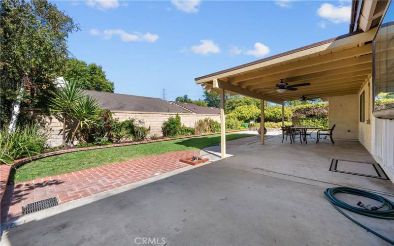 Backyard with covered patio.