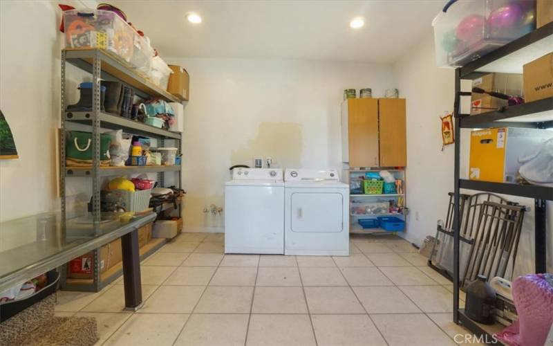 The laundry room is generous in size and is located in the back of the home.