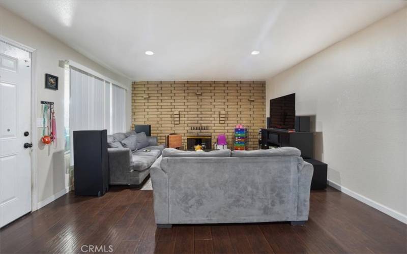 Stepping into the home the wall to wall fireplace in the living room is an attractive centerpiece.