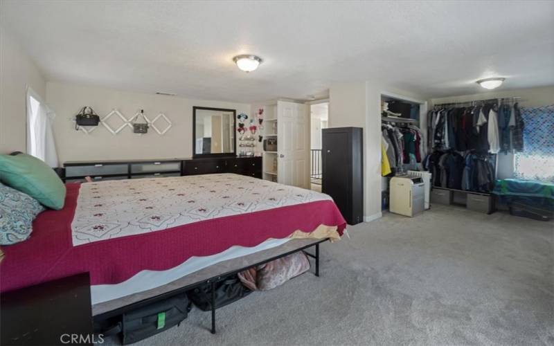 The primary bedroom has a large closet area.