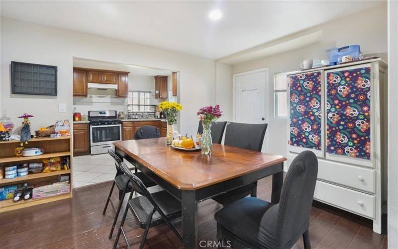 The dining room is in the middle of the home with a door that enters into the side yard.