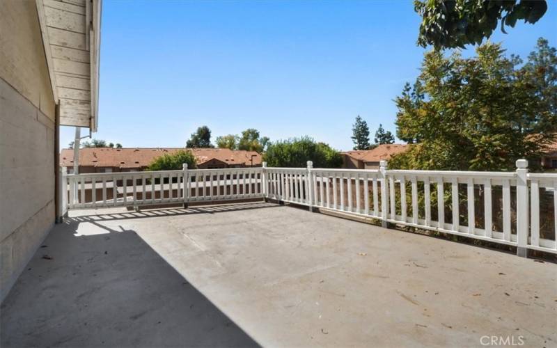 The extra large balcony off of the primary bedroom is the perfect spot to relax at the end of the day.