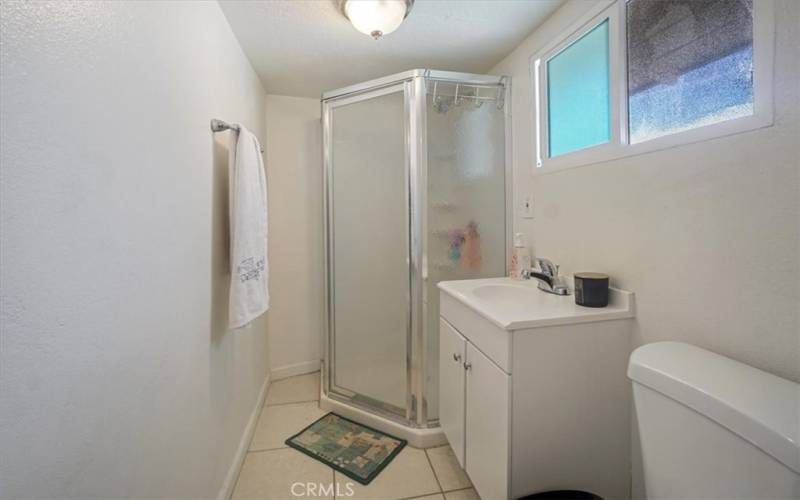 The upstairs hall bathroom has a walk-in shower.