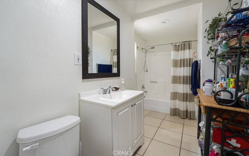 The full bathroom downstairs has a bathtub/shower combination and plenty of space for extra storage.