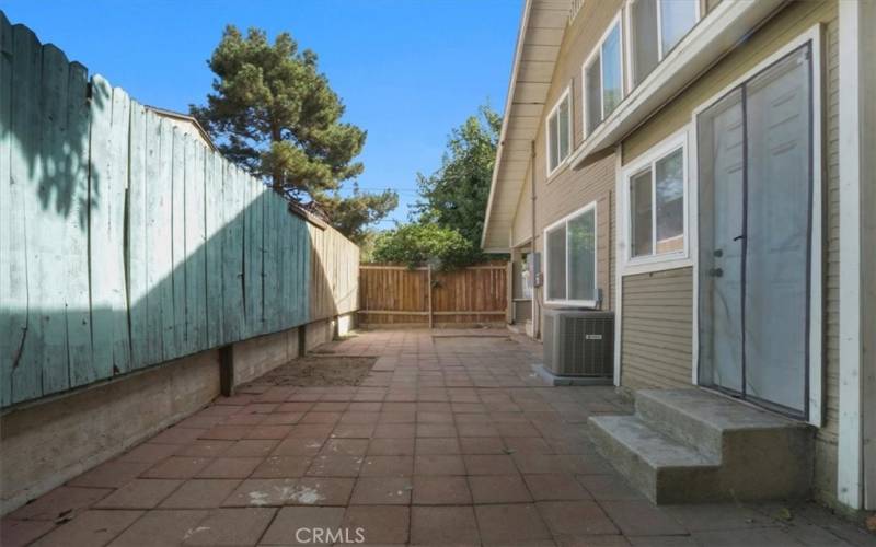 The side yard door to the right leads you into the dining area.