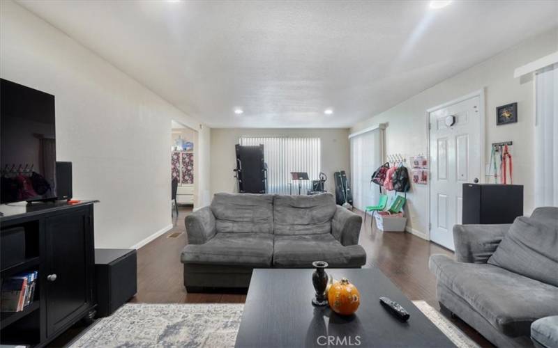 The living room is very spacious and has a couple of seating areas with many options.