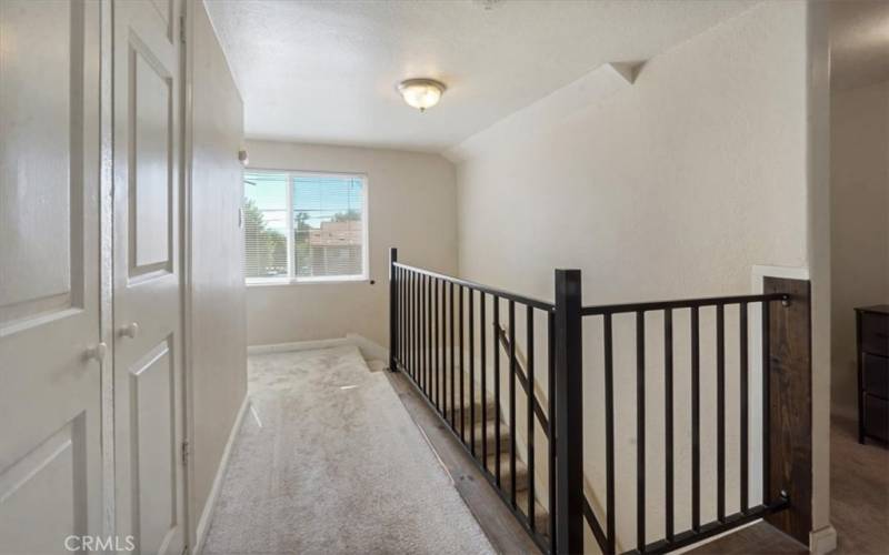 The is added storage upstairs and a hall window that keeps the natural light flowing. Next to the window is Bedroom 4.