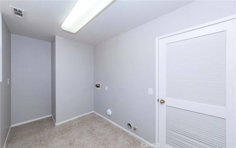 Spacious laundry room on main floor