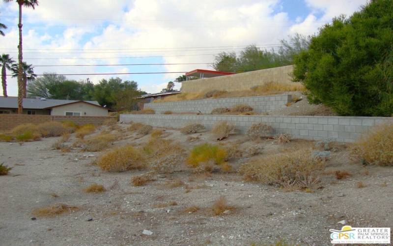 Neighbor Has Placed An Expensive Retaining Wall