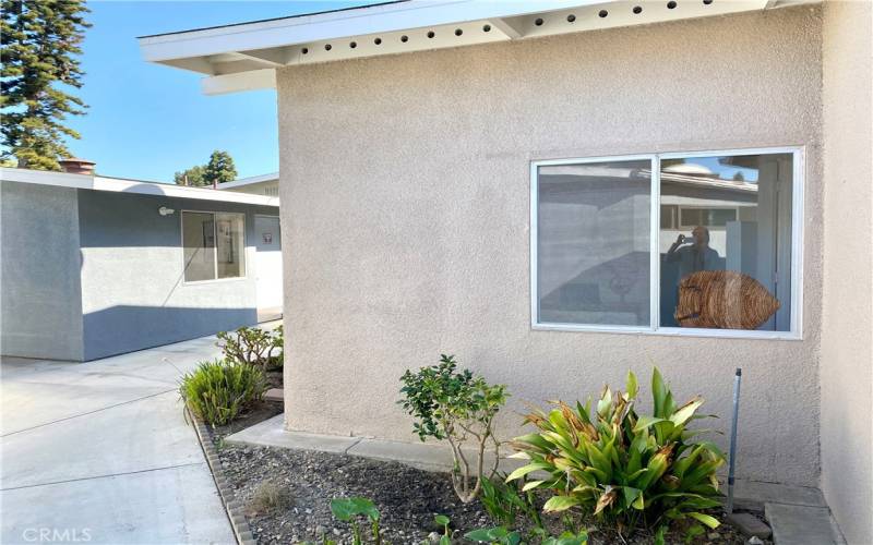 Unit on the right, laundry room on the left through the breezeway.