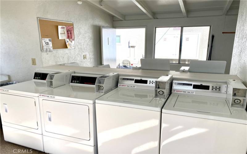 Very well-kept laundry room right next door!  .75 for wash, .25 for dry