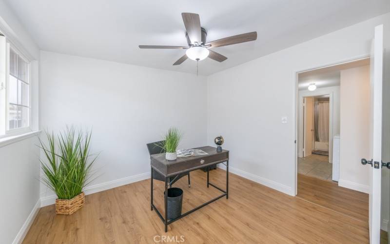 One of the three bedrooms currently staged as an office