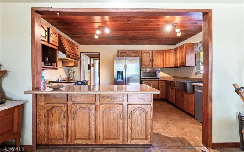 Sublime flow into the kitchen. The breakfast bar is a great spot for a casual meal or serving food.