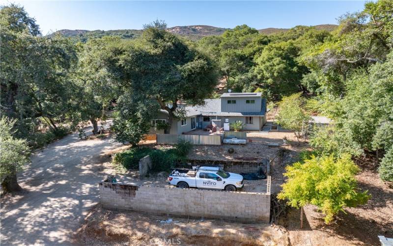 Privacy is escalated by the many large oak trees on the property.