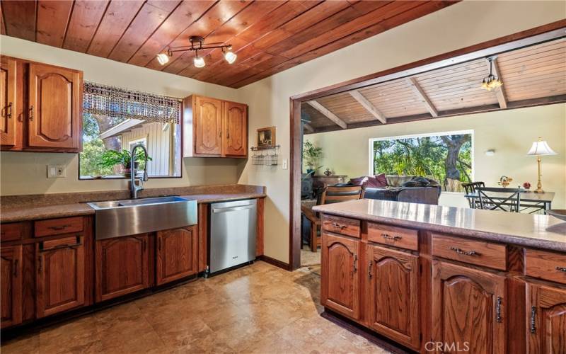 Stainless steel appliances and gorgeous wood ceiling accent the kitchen nicely.