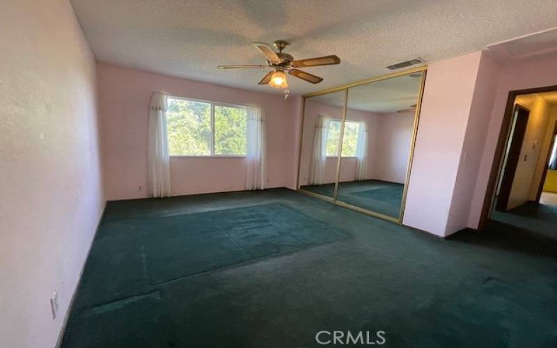 Master Bedroom with mirror floor to ceiling closet doors