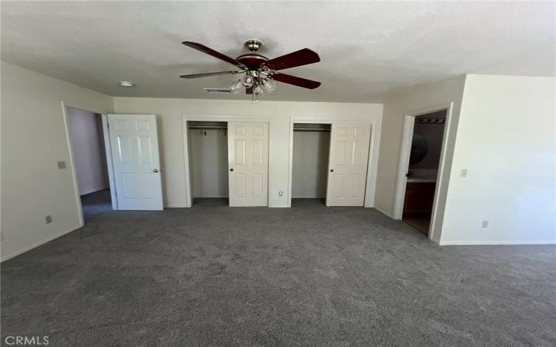 Primary bedroom with dual closets