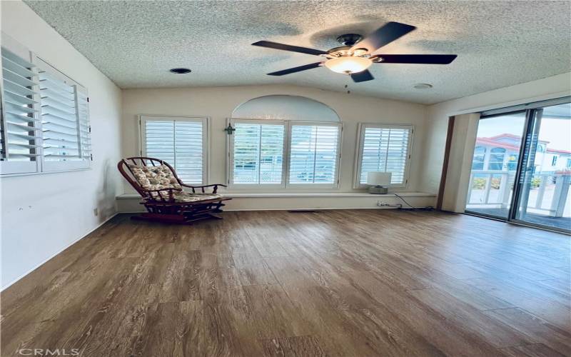 Shutters throughout the home. California entrance into the bright living room. Ez to maintain flooring.