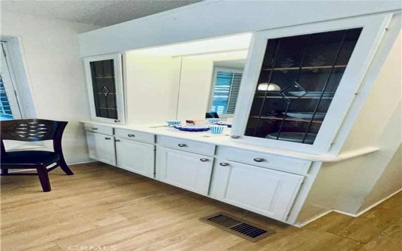 Built in hutch with mirror, light and glass doors.