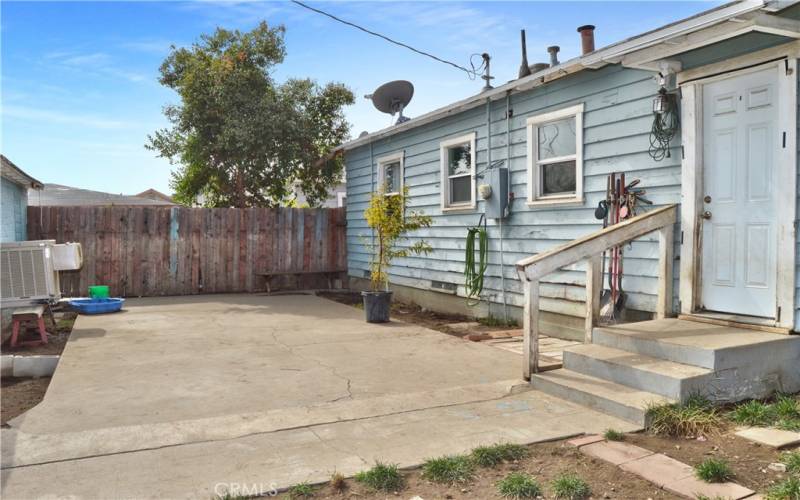 This large concrete patio right outside the kitchen door is a great place to host a barbecue!