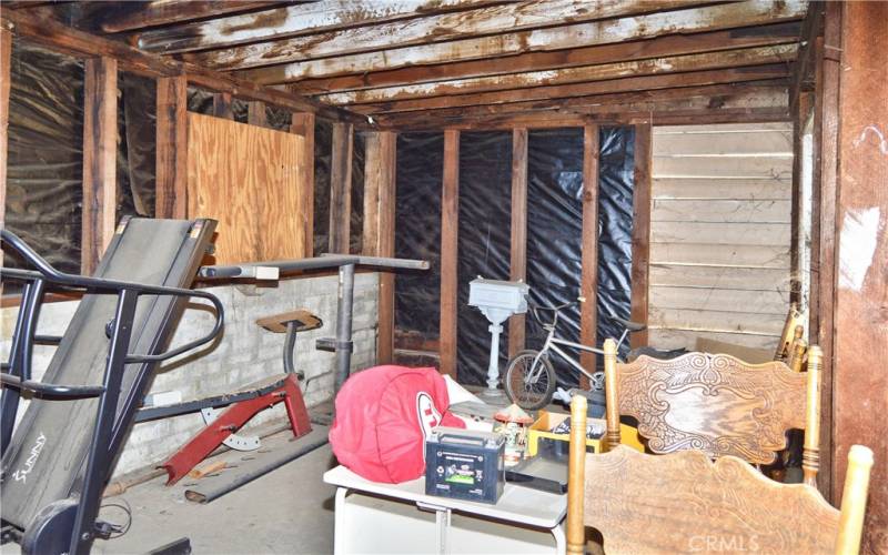 Interior view of the larger (2nd) garage which offers 846 sq ft of space for cars, toys, hobbies, storage, or maybe even an ADU. There are so many possibilities to explore here!