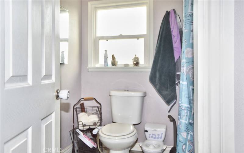 The main bath was remodeled in 2018 with new porcelain tile flooring, tiled shower walls with mosaic accents, new tub, new shower faucet, new vanity, and a new toilet.