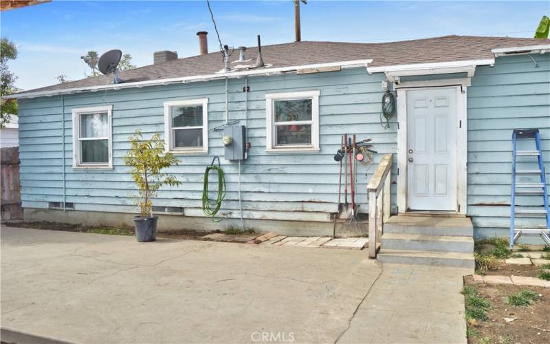 This large concrete patio right outside the kitchen door is a great place to host a barbecue!