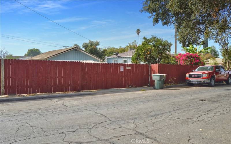 Gated Driveway to the 532 sq ft Garage with the house visible to the right. This property is fenced and cross-fenced and offers so many options!