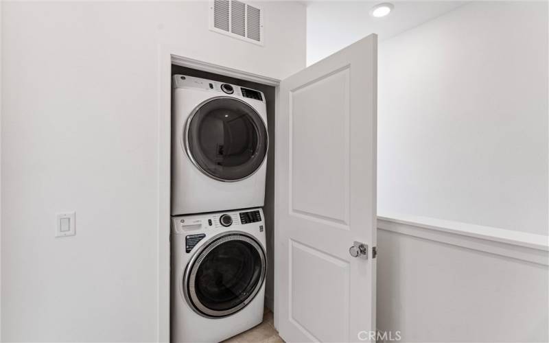 Stacked Laundry closet off Primary Bedroom