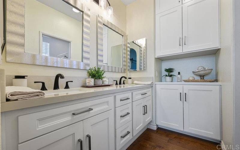 Private Dual sink with Custom Cabinetry to maximize storage space. Upgraded Hardware.