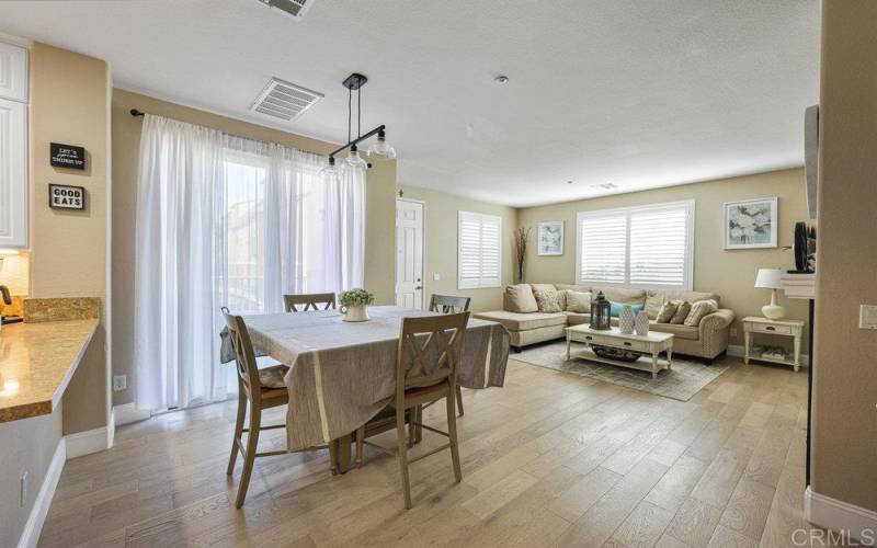 Open Concept Living and dinning offers Real Wood flooring, Natural Lighting, Plantation Shutters.