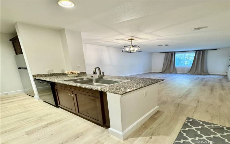 View of kitchen and looking into the dining room and living room