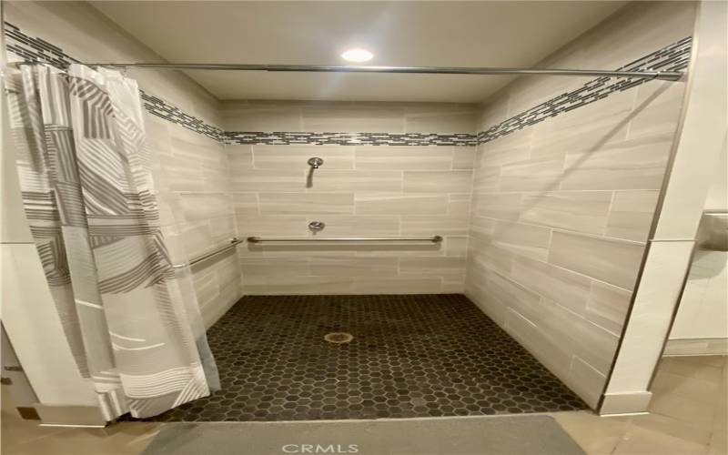 Shower in bathroom by pool/gym