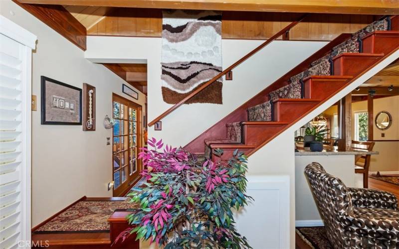 STAIRCASE LANDING STEPS DOWN TO KITCHEN OR GATHERING/ LIVING ROOM