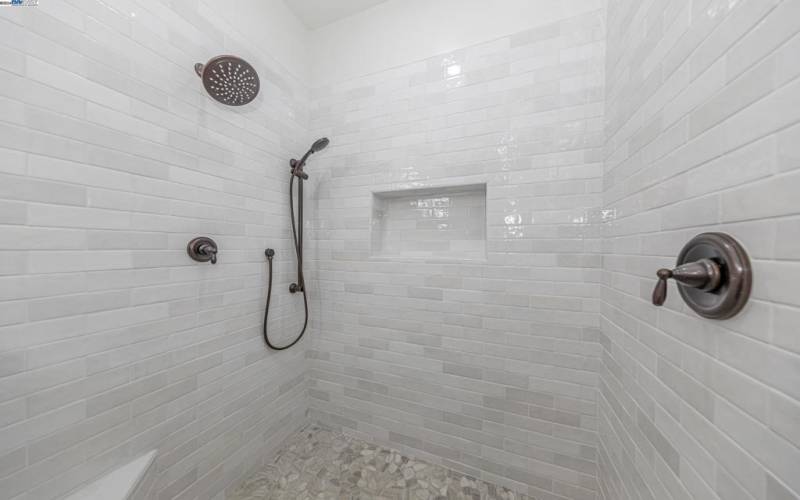 Tiled shower to ceiling