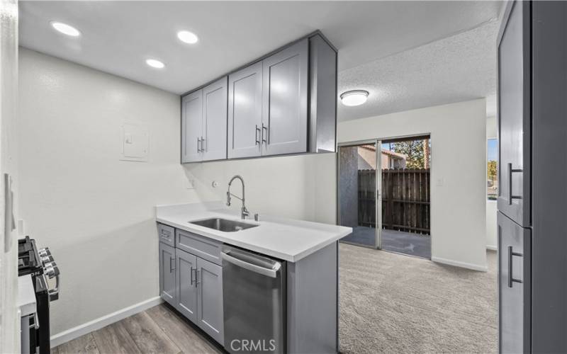 kitchen view to dining area and patio.