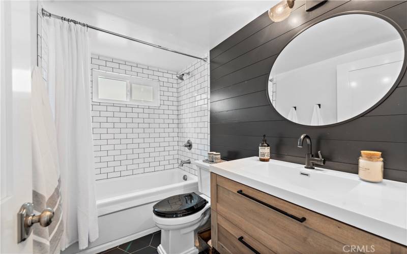 Downstairs bathroom with shower/tub combo