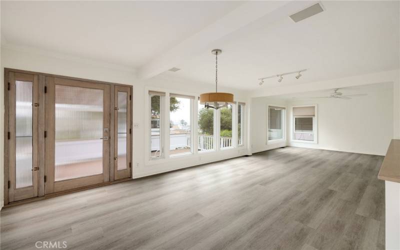   main entry and living room/dining room with peek-a-boo ocean view