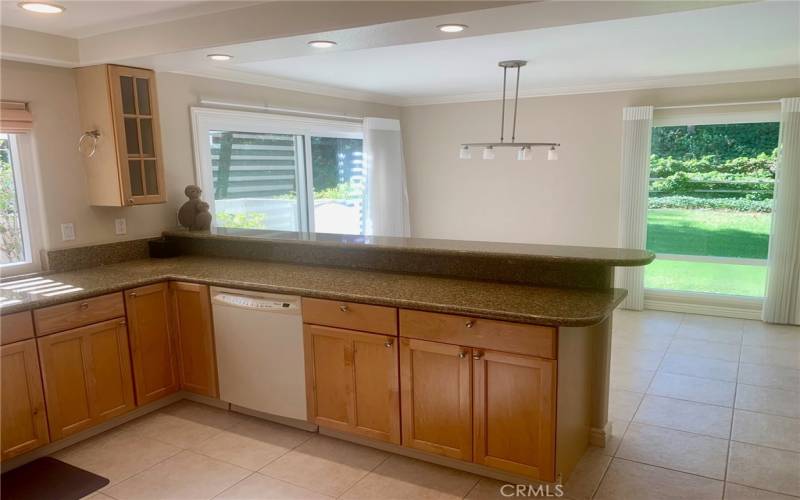 Kitchen has been highly upgraded with attractive wood cabinetry, granite countertops and a breakfast bar that seats up to four.